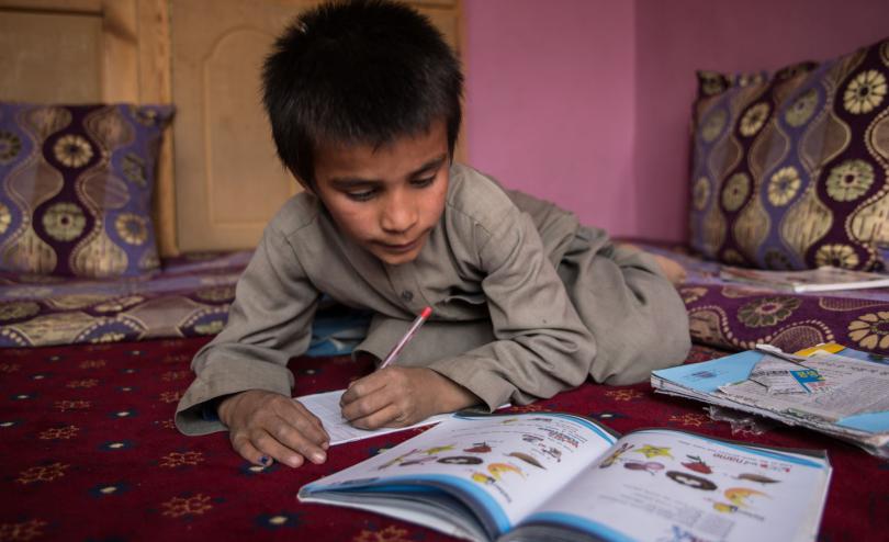 Hemat*, 10, does his homework