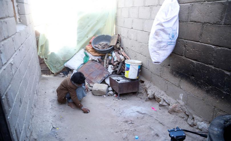 Abed*, 11, plays outside his home in North-West Yemen.