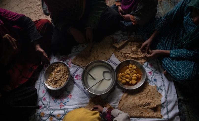 Hamida*, 11, eats with her family at home before going to school supported by Save the Children in a village outside Kandahar, February 3, 2020.