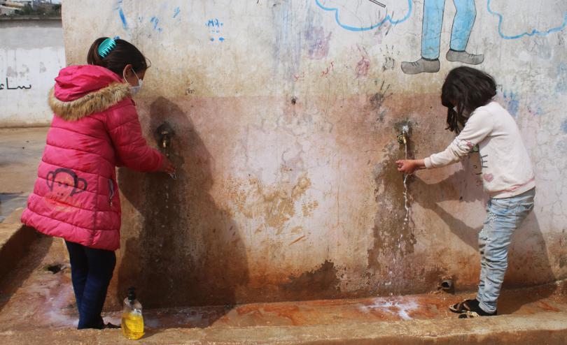 Children washing their hands