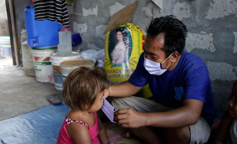 Aldrin puts a mask on his daughter