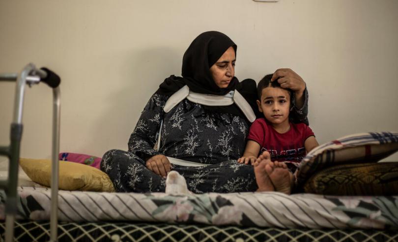 Said*, 6, is comforted by his mother Em Mahmoud at their home in Beirut