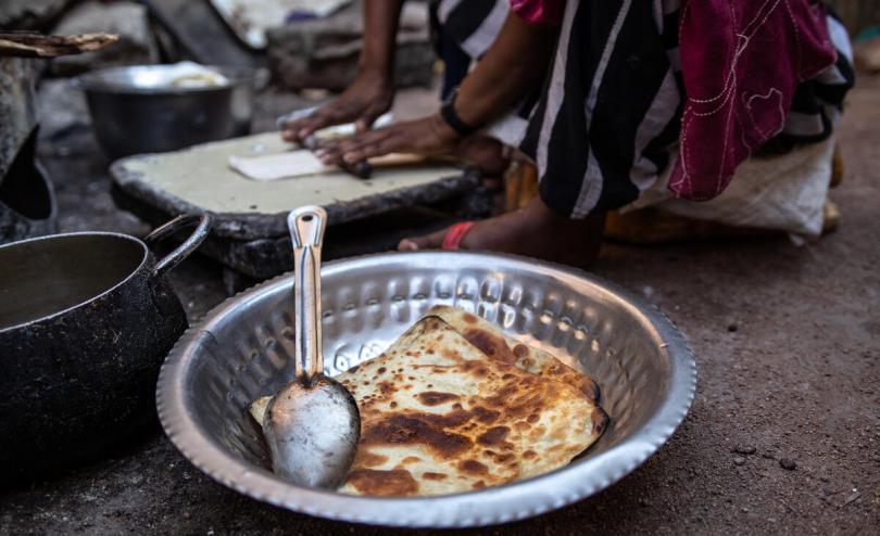 A child impacted by the drought in Somalia selling chapatis to support her family (Sacha Myers / Save the Children)