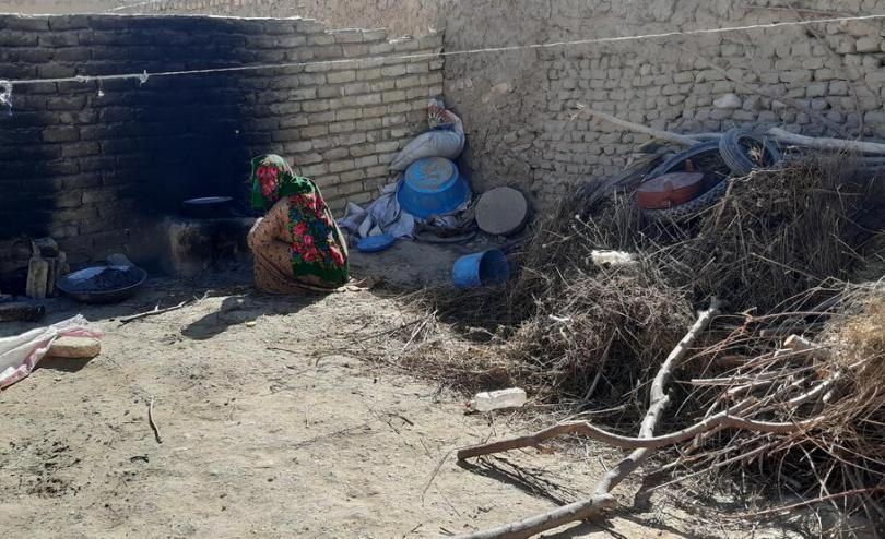 Abdul*s kitchen where he stores tyres and woods to heat his family's home in Faryab province, Afghanistan.