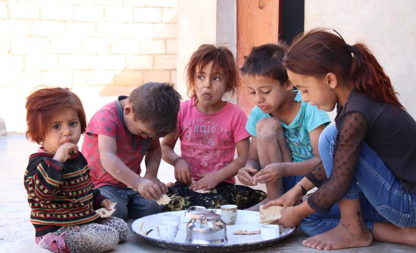 Maha's children having tea