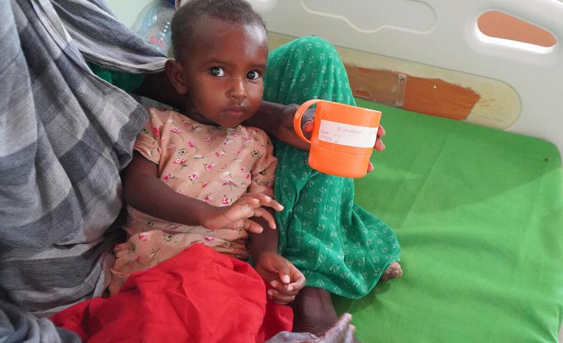 A child receives milk and therapeutic food treatment at a Stabilization Center in Qardho 