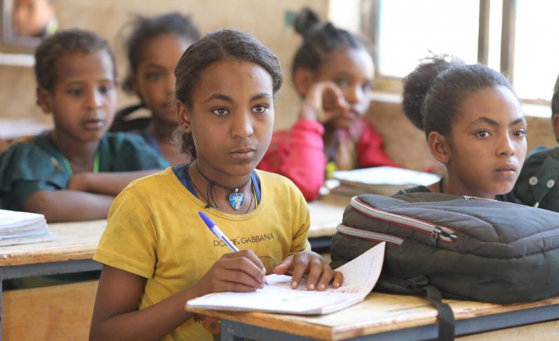 child at a school desk