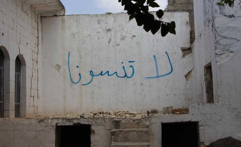 Bana*, 17, took this picture of a damaged house in Northwest Syria where the writing on the wall says ‘don’t forget about us’
