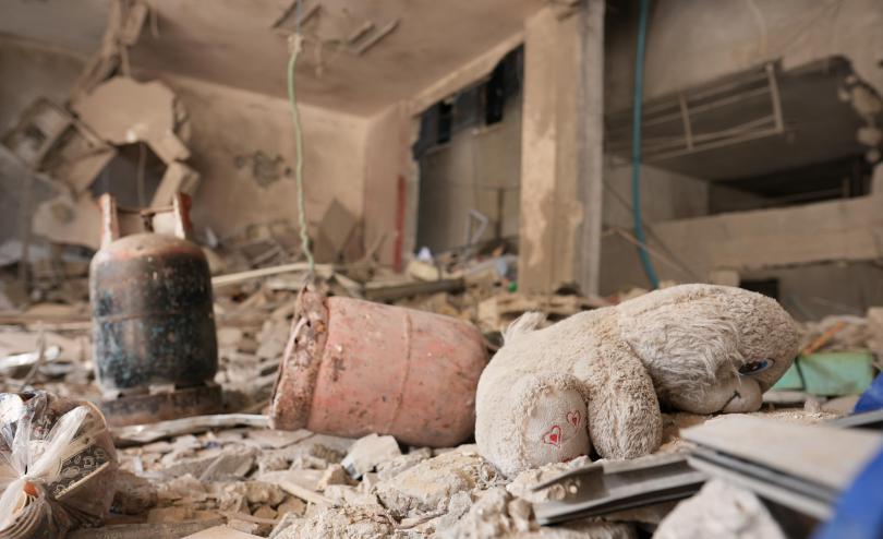 A doll amid rubble of a damaged building in Gaza