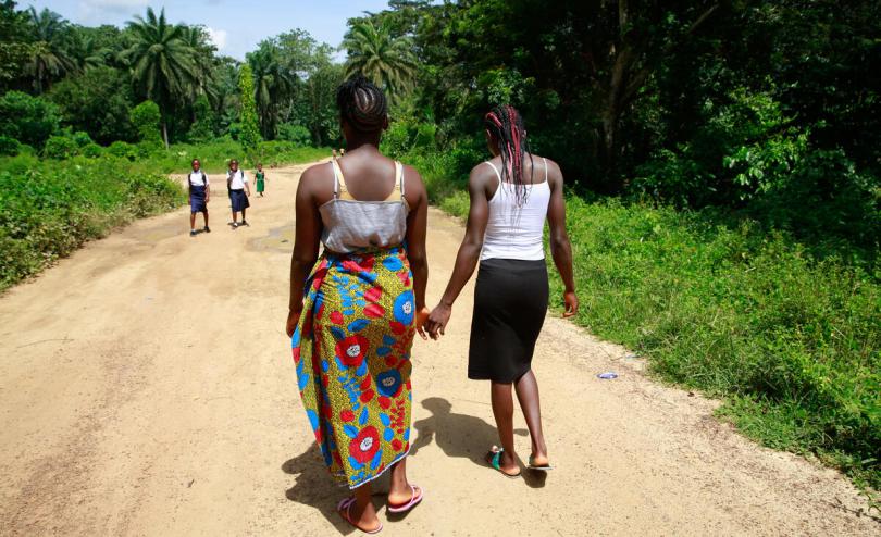 Two girls in Sierra Leone holding hands