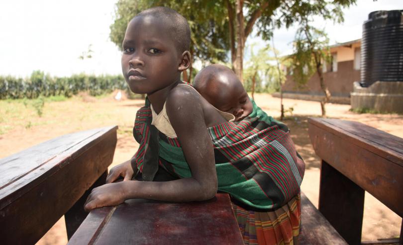 Child with sibling at school for food 