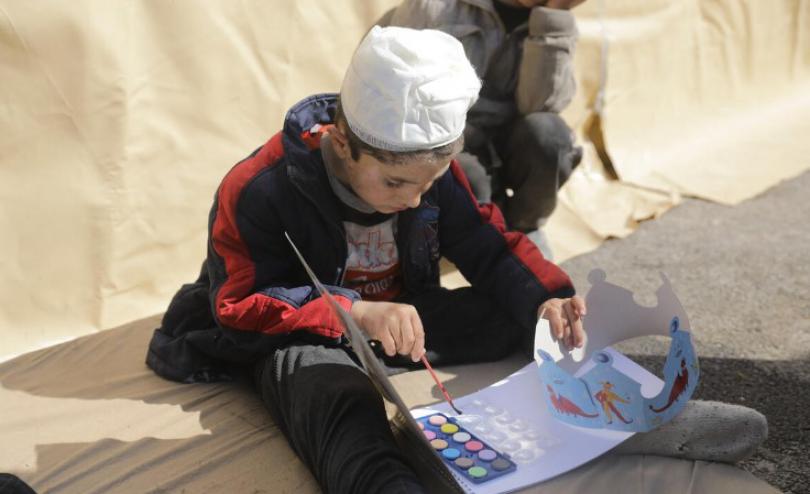 Samer*, 6, enjoying child-friendly activities run by a Save the Children local partner in northern Syria. 