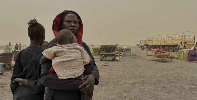 Adit*, who fled from Khartoum with her six children, at Joda border point on her way to Transit Centre 2, South Sudan