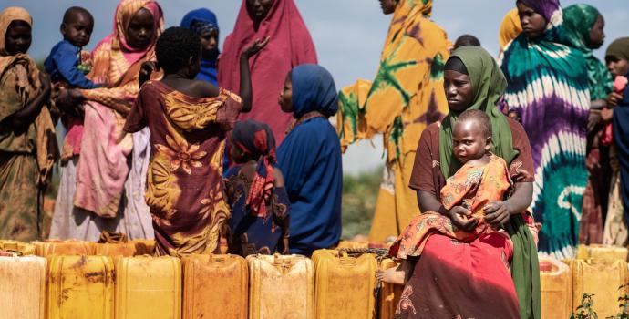 A group of women and children waiting in line to buy water in Baidoa, Somalia
