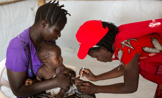 Baby Exodus, six months old, recieves childhood vaccinations in Bidi Bidi camp in North Uganda.