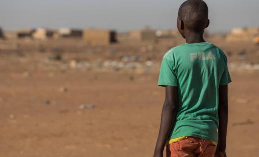  Issa*, aged 13, walking home from school in Tillaberi region, Niger.