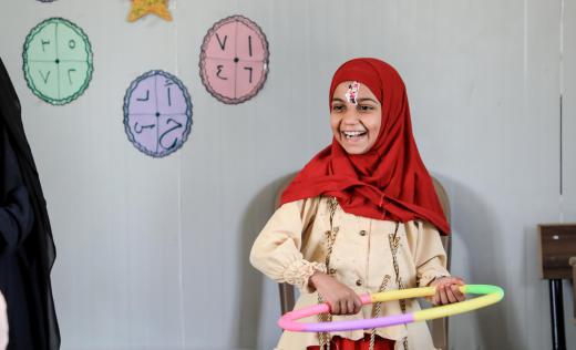 Sandi*, 9, during an activity at Save the Children's Temporary Learning Space in a displacement camp in Northeast Syria