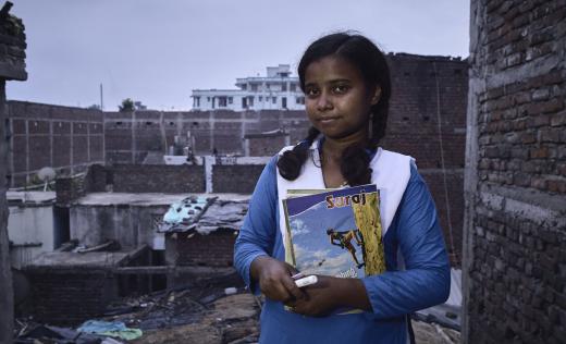 Munni, 16, at home after teaching a literacy class in Bihar, India