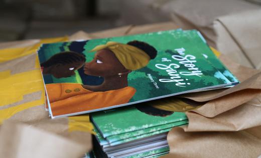 A book is distributed in Uganda