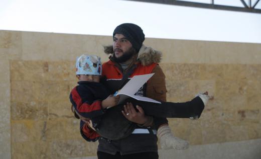 samer is carried by aid worker