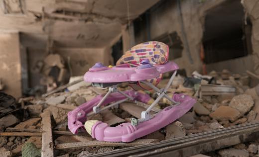 A child rocking chair among rubble in Gaza, photographed in October 2023