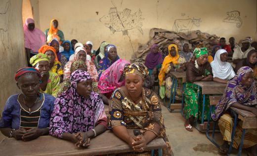 Parents in a classroom at the school they advocated for to be reopened