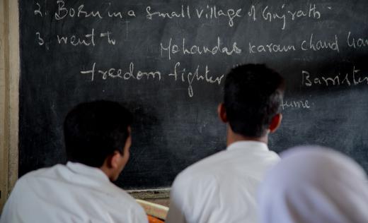 Rohingya refugees AK*, 17 and Mohammad*, 18, during a history class at their school in south India