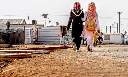 Two anonymous girls walk through the Zatari refugee camp in Jordan 