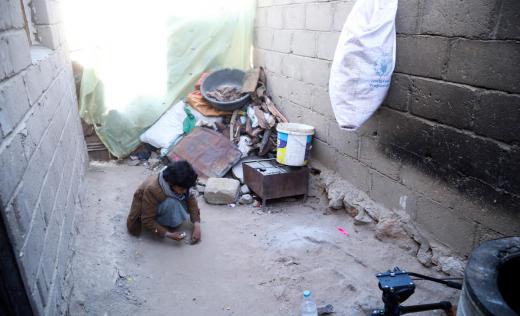 Abed*, 11, plays with marbles outside his home