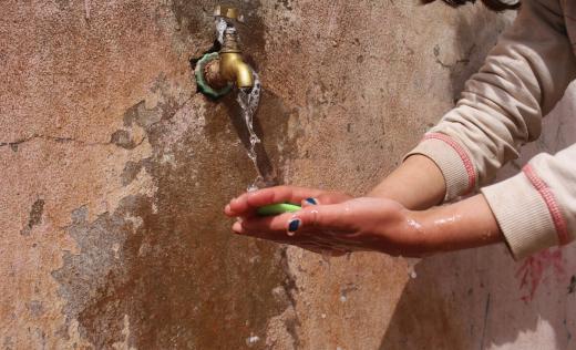 Tala*, 9 washing her hands