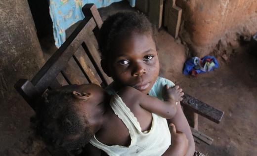 Michelle*, nine years old and her one year old sister, Gloria* in Kasai region, DRC