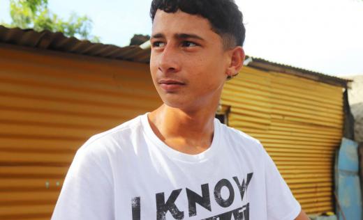 Sebastian*, 16, in the camp where the family lives in Colombia