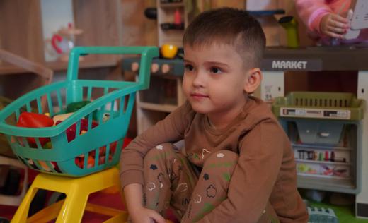 David, 5, plays with toys in Kharkiv