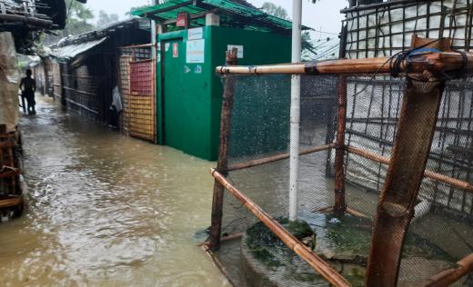 a flooded street in a camp