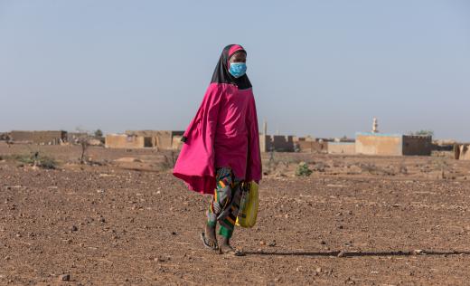 A girl walking home from school in Tillaberi region, Niger