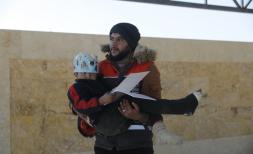 samer is carried by aid worker
