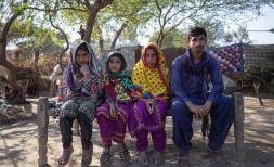  Waqas, 17, his mother Raheema, 40, and sisters Nafeesa, 10, and Saira, 15, in front of their home in a village near Khairpur, Sindh, Pakistan