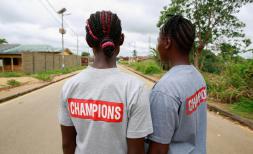 Cousins Kuji*, 19 and Kpemeh*, 18 wear their Ending Child Marriage Champion t shirts in Kailahun, Sierra Leone