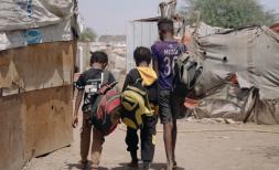 Student Walking in a displacement camp in Yemen