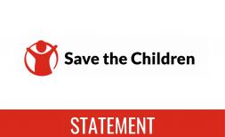 Red and white Save the Children statement card