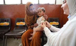 Child being screened for malnutrition in Syria