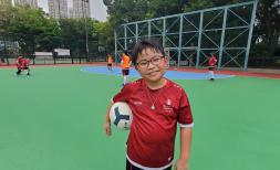 Daniel, 11, from Hong Kong, poses as he joins a 'Play to Thrive' football programme by Save the Children Hong Kong.