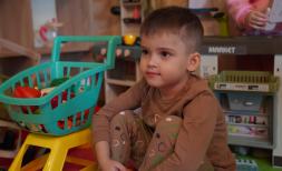 David, 5, plays with toys in Kharkiv