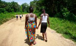 Two girls in Sierra Leone holding hands